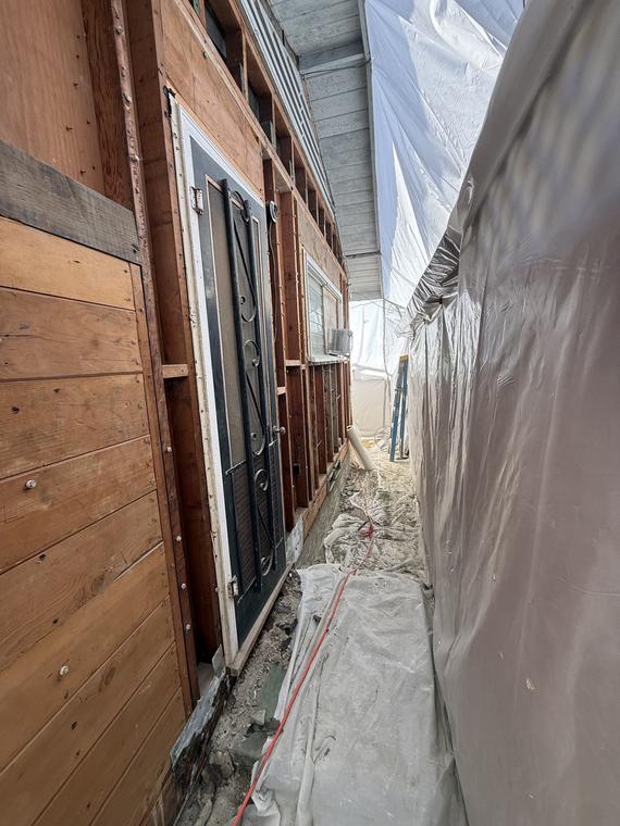 Exterior of a building wrapped in containment